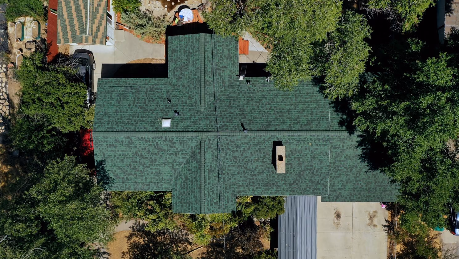Aerial view of the same Orem, Utah home after roof replacement with Owens Corning Duration Chateau Green architectural shingles