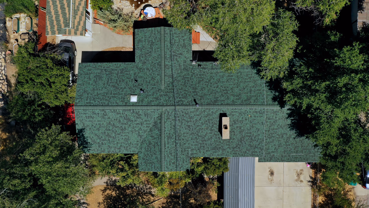 Aerial view of the same Orem, Utah home after roof replacement with Owens Corning Duration Chateau Green architectural shingles